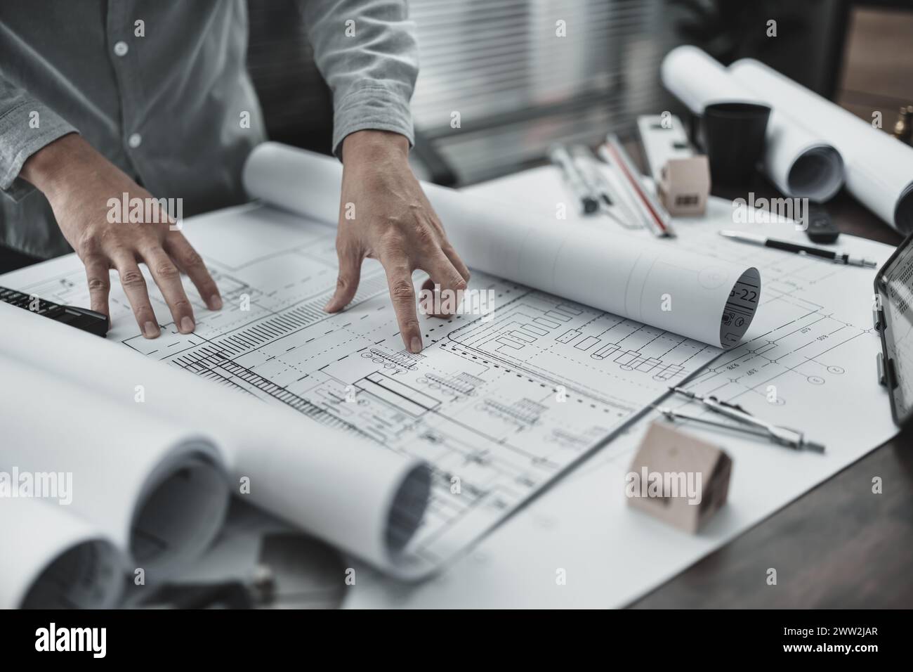 Architect engineer read drawing design working on blueprint. House planning design and construction concept. Stock Photo