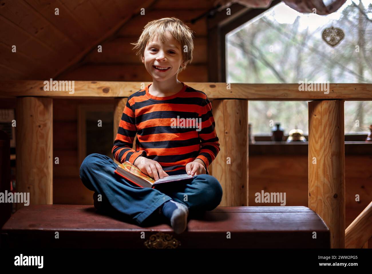 Cute child, boy in an rural village cottage Stock Photo