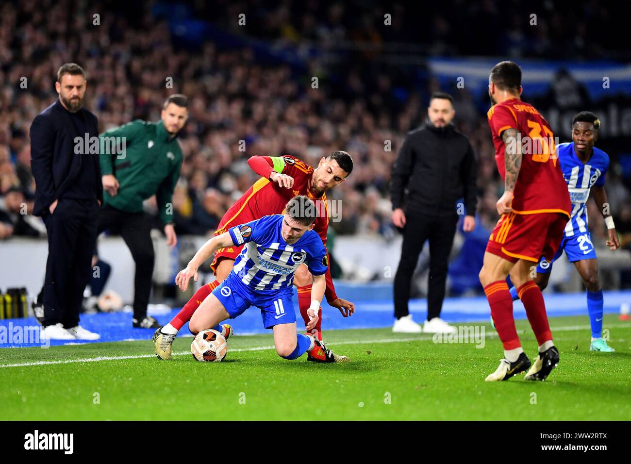 Billy Gilmour of Brighton and Hove Albion and Lorenzo Pellegrini of AS Roma compete for the ball  - Brighton & Hove Albion v Roma, UEFA Europa League. Round of 16, Amex Stadium, Brighton, UK - 14th March 2024 Stock Photo