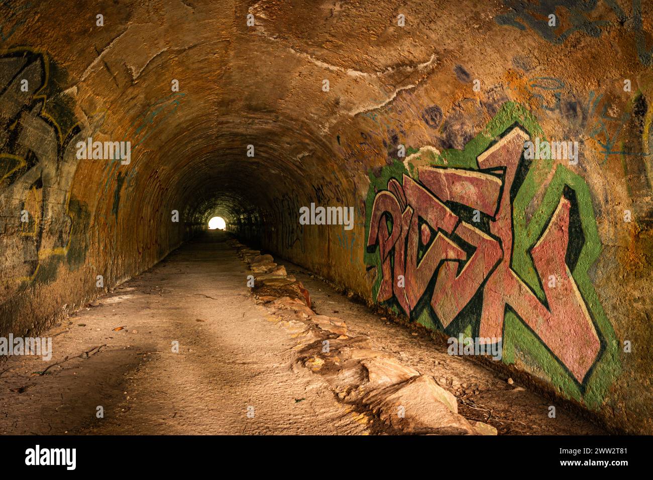 Rustic Graffiti Colorful graffiti art inside a rustic tunnel Stock Photo - Alamy