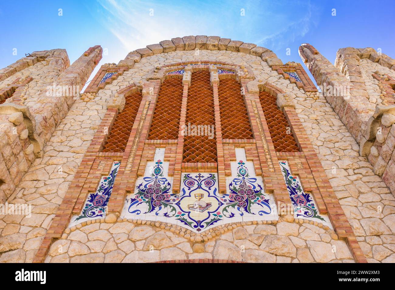 Facade with ceramic tiles decoration of the church in Novelda, Spain Stock Photo