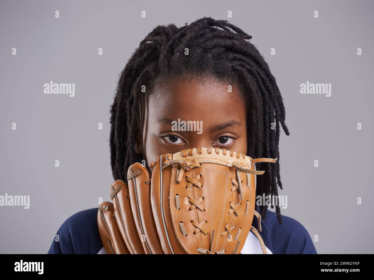 Sports, baseball and portrait of child on gray background with glove for training, practice and match. Fitness, youth and young boy with equipment for Stock Photo