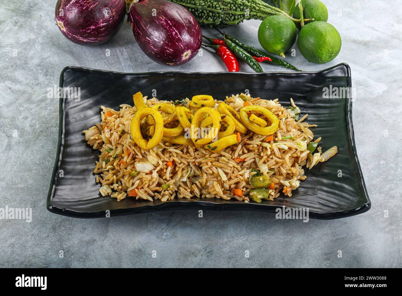 Asian cuisine - Fried rice with squid rings Stock Photo - Alamy