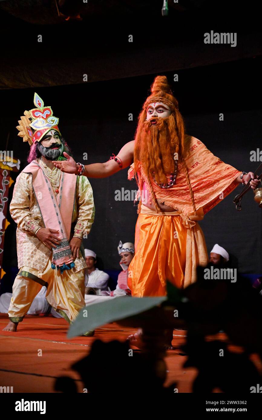 The talented actors of Abinaswar Gosthi, Nagaon, breathe life into Srimanta Sarkardev's timeless Ankiya Bhaona 'Ram Bijoy' with their captivating performance under the direction of Dipok Borah in Puranigam, Nagaon, Assam. Stock Photo