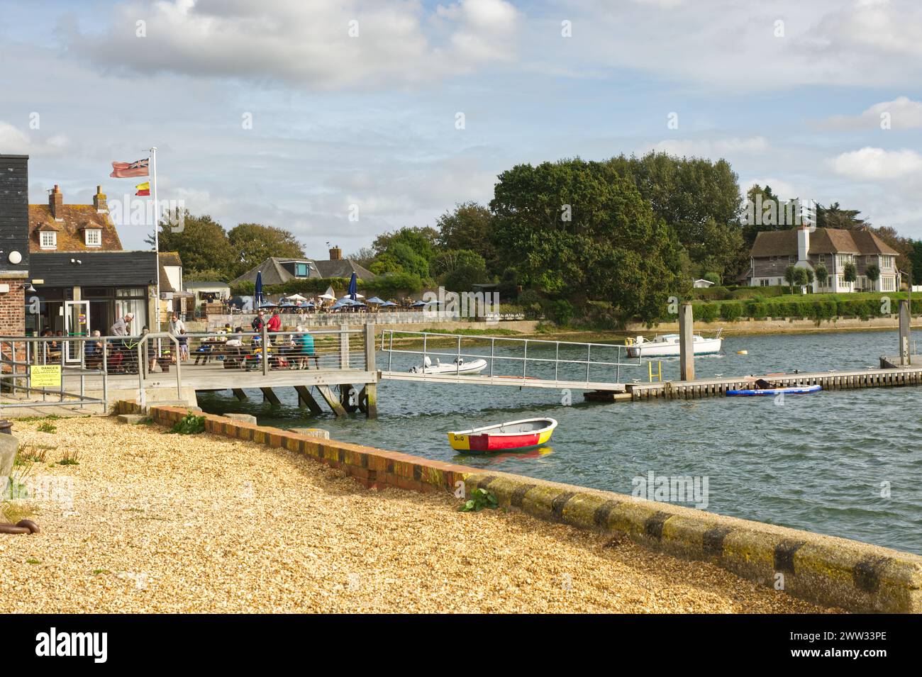 People on waterfront at Dell Quay in Chichester Harbour, West Sussex, England Stock Photo