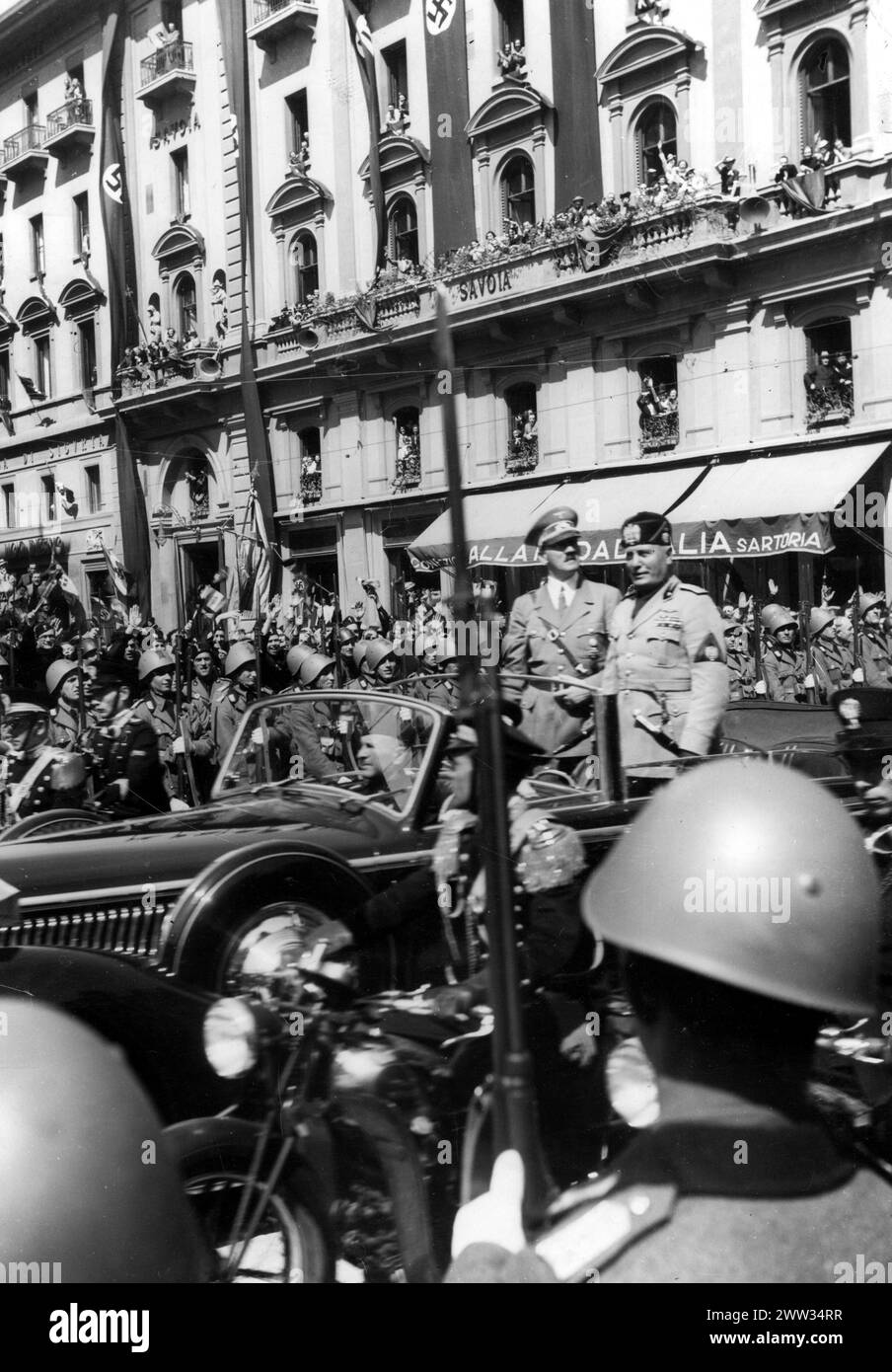 The leader of the Third Reich, Adolf Hitler (left) and the leader of the Italian state, Benito Mussolini, in a car. The people of Florence welcome their leaders, 1940 Stock Photo