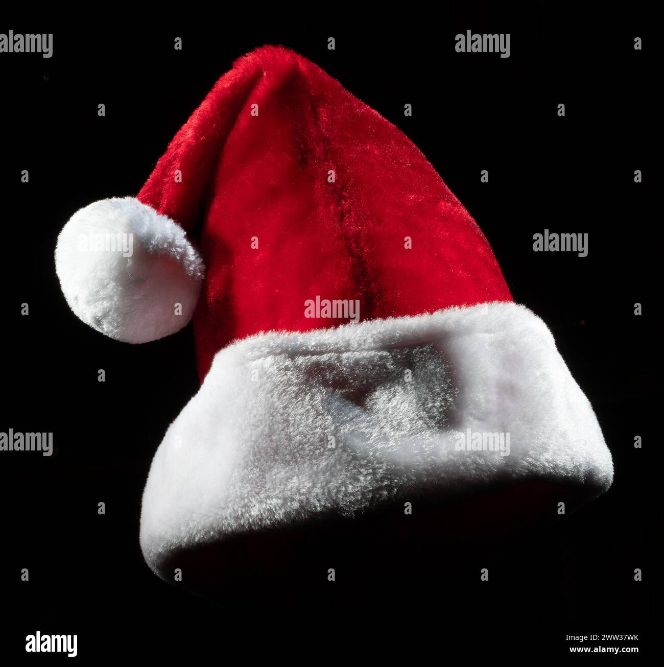 Hat usually worn by Santa Claus on Christmas Eve on a black background ...