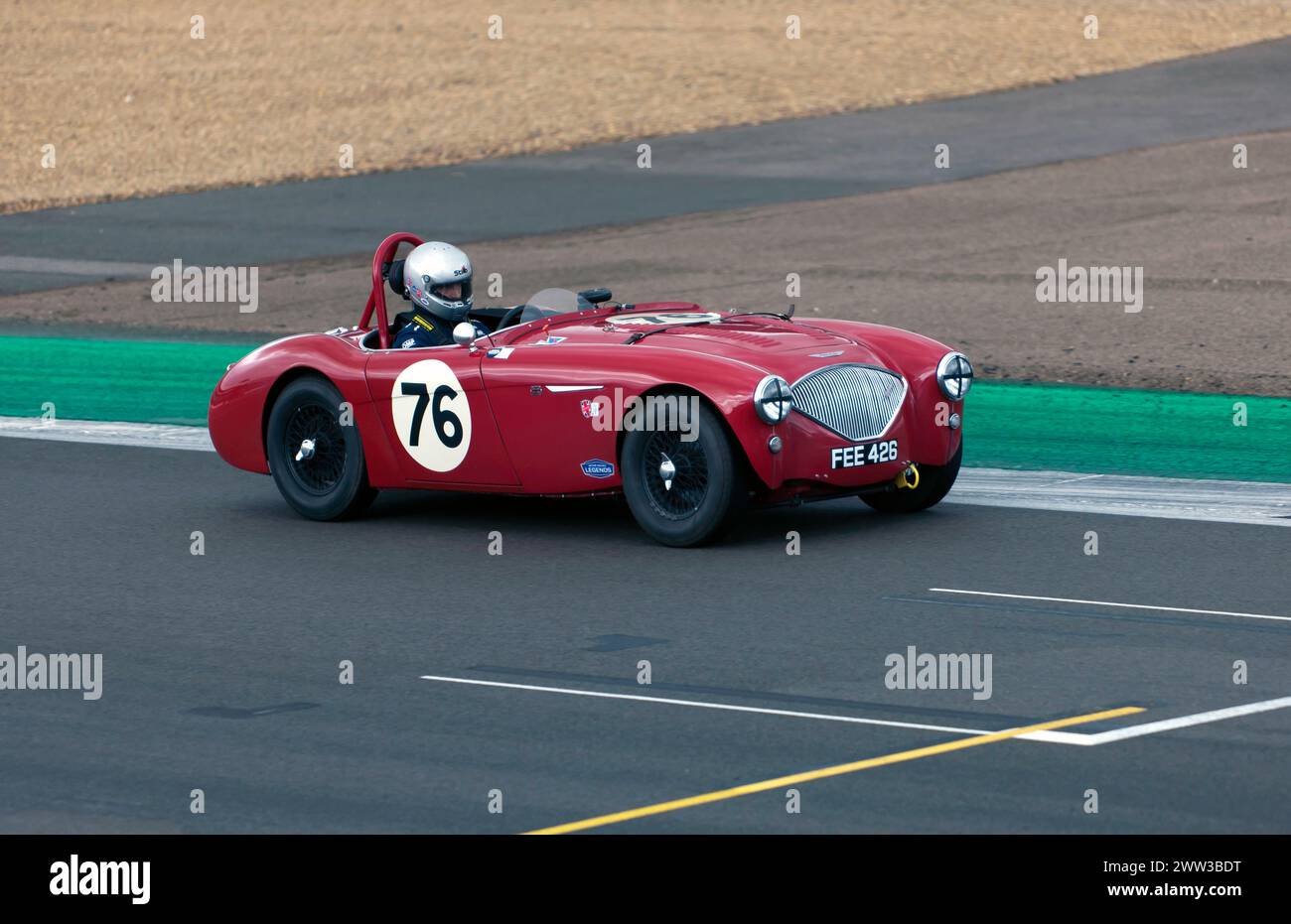 Nicholas Harris driving his Red, 1954, Austin-Healey 100/4, during the MRL RAC Woodcote Trophy, at the 2023 Silverstone Festival Stock Photo