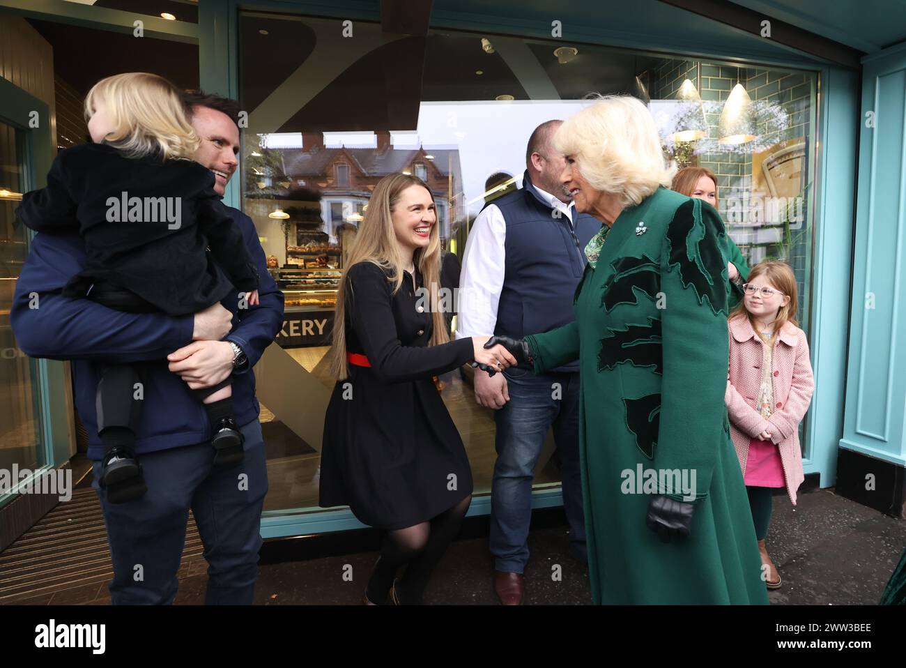 Queen Camilla (centre right) meets the owner of Knotts Bakery, William