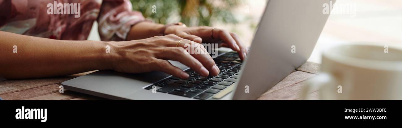 Web banner with hands working on laptop Stock Photo