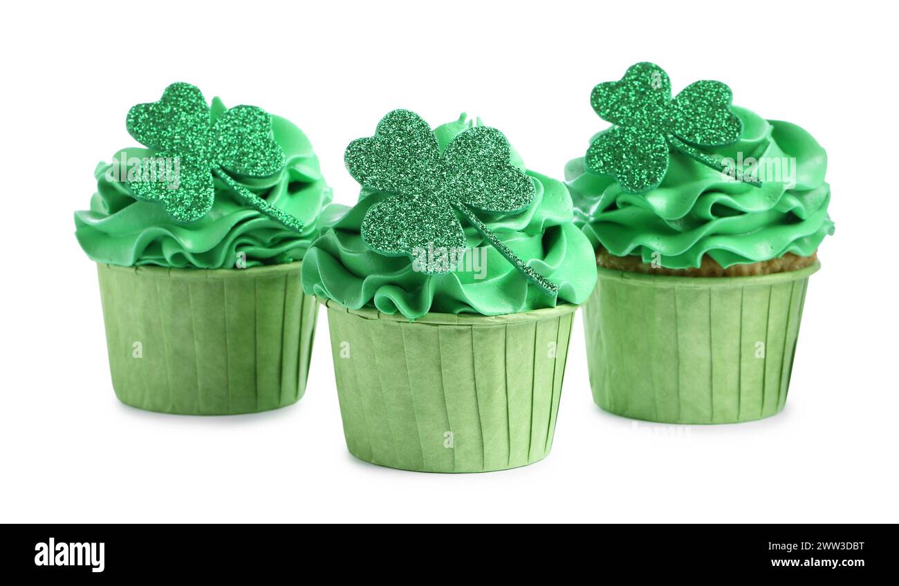 St. Patrick's day party. Tasty cupcakes with green clover leaf toppers and cream isolated on white Stock Photo