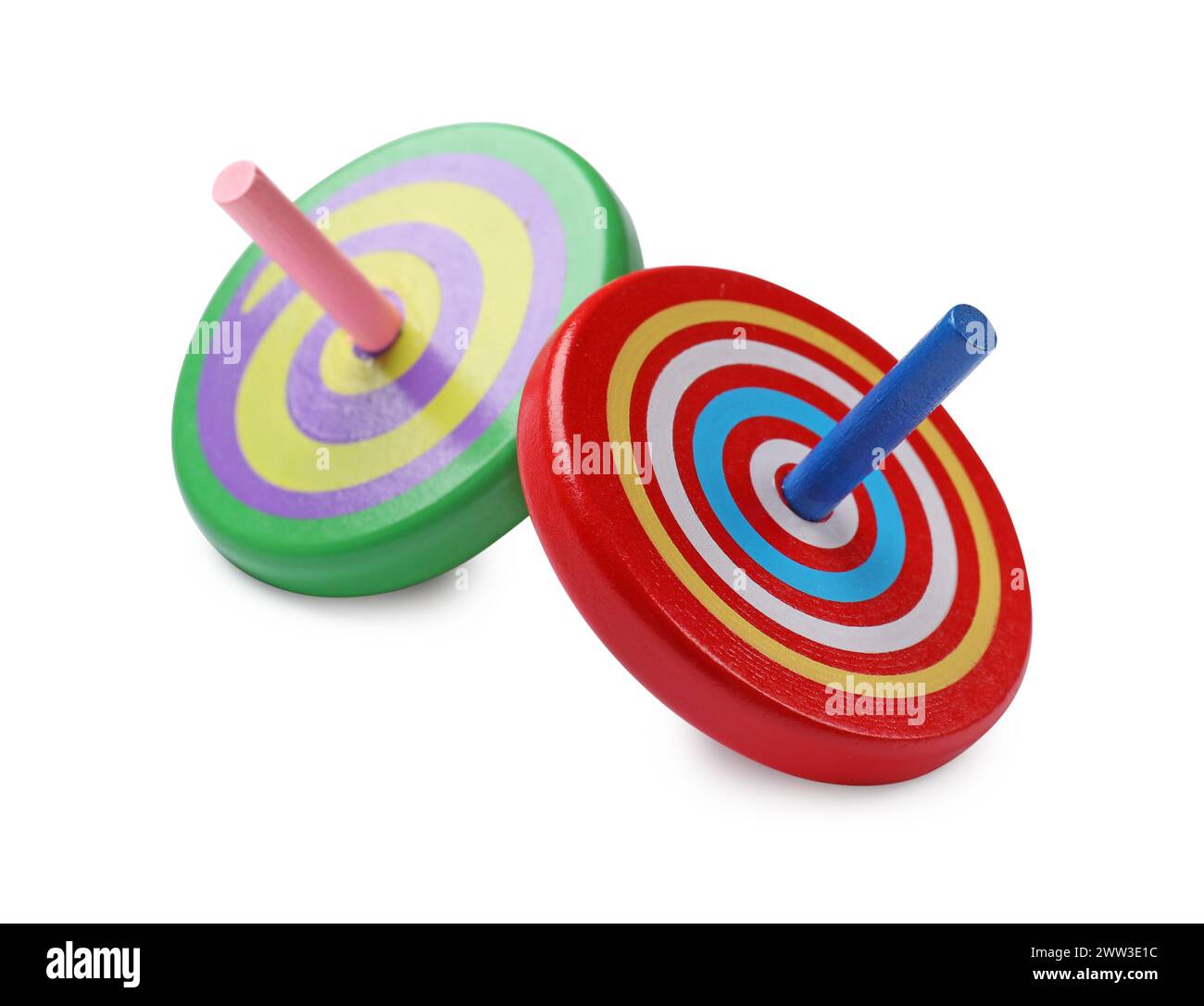 Two bright spinning tops isolated on white Stock Photo Alamy