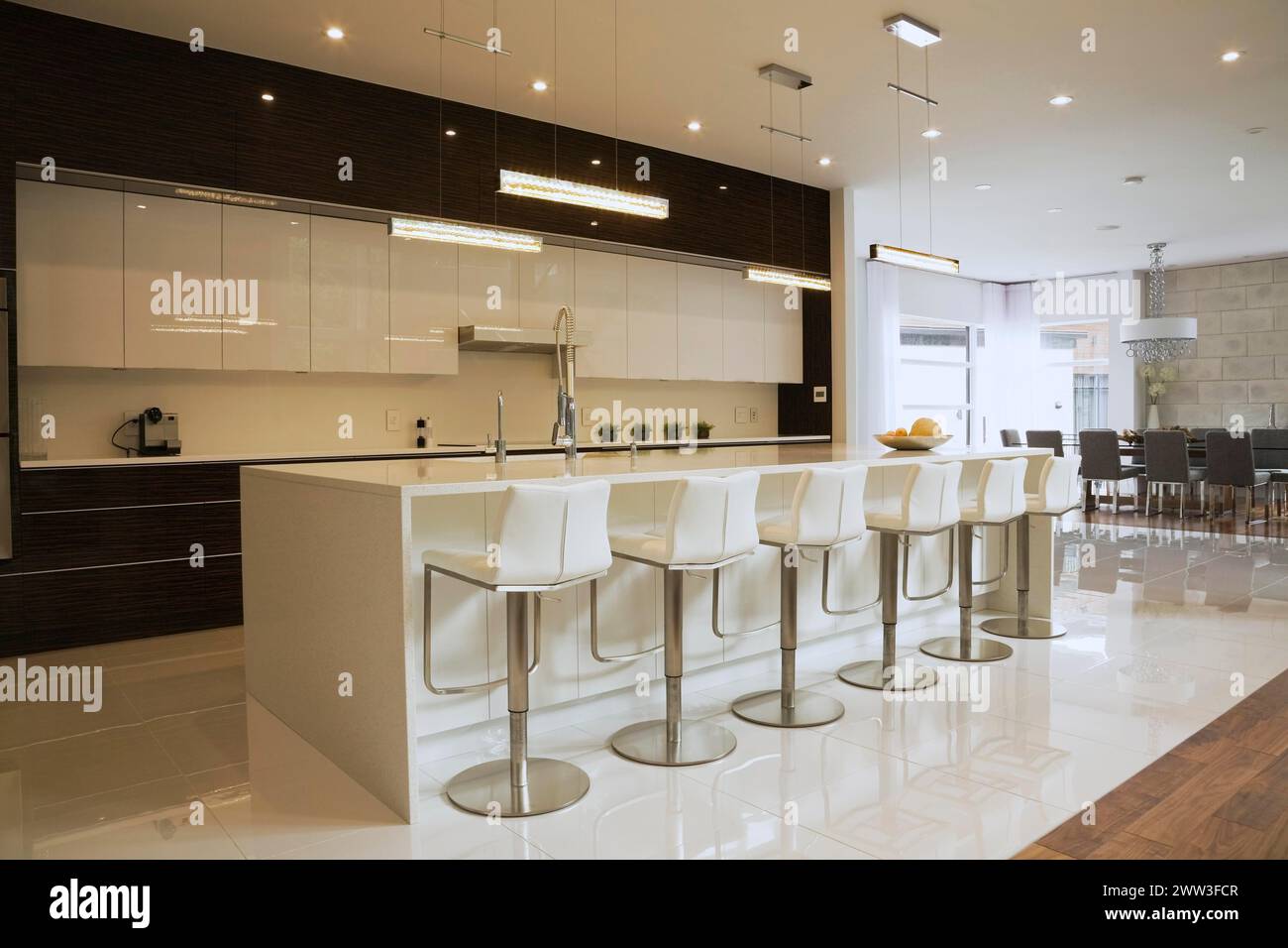 Quartz countertop island with white leather and stainless steel ...