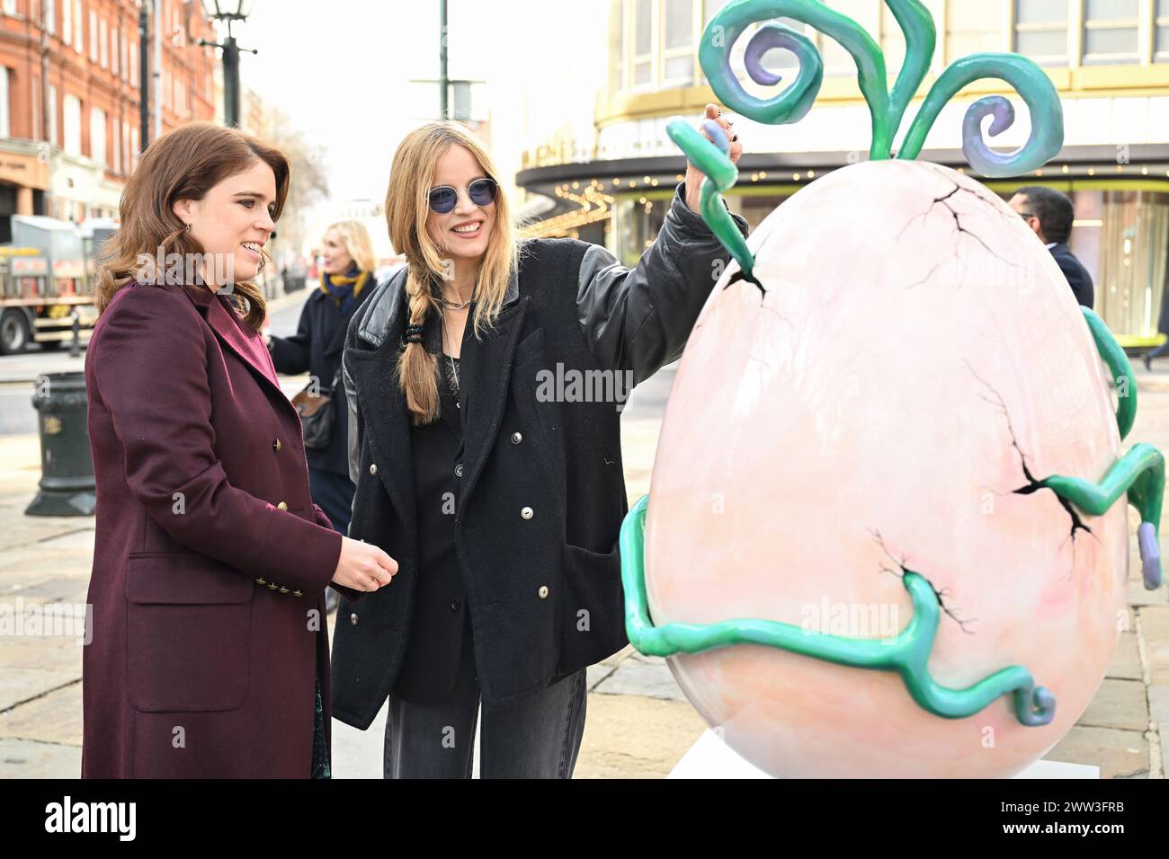EDITORIAL USE ONLY Princess Eugenie speak to artist Charlotte Colbert at Elephant Family's Little Egg Hunt, presented by Clarence Court, in Chelsea, London, an interactive large-scale egg hunt, with pieces designed by 12 leading designers. Picture date: Thursday March 21, 2024. Stock Photo