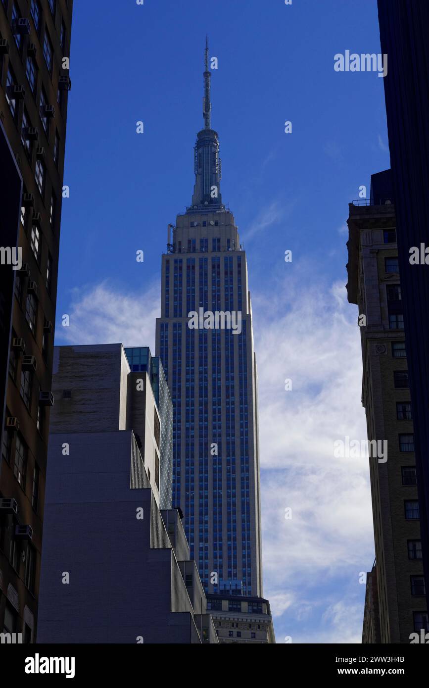 The Empire State Building rises with its characteristic silhouette into the blue sky, Manhattan, New York City, New York, USA, North America Stock Photo
