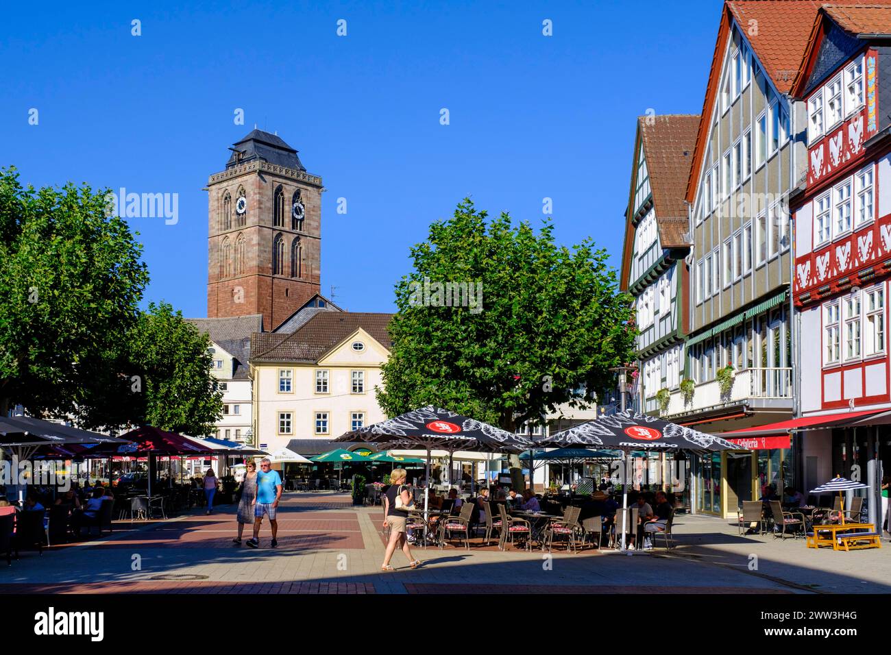 Pedestrian zone with restaurant and street cafe, Linggplatz, bell tower of the Gothic town church, Old Town, Bad Hersfeld, Hesse, Germany Stock Photo