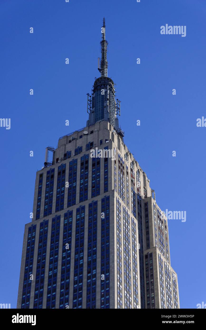 The Empire State Building rises into a deep blue sky, Manhattan, New York City, New York, USA, North America Stock Photo