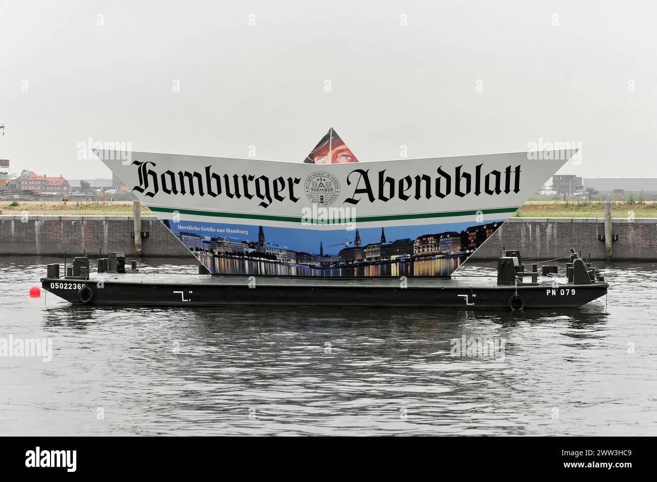 Ship with a large advertising banner of the Hamburger Abendblatt on a river, Hamburg, Hanseatic City of Hamburg, Germany Stock Photo