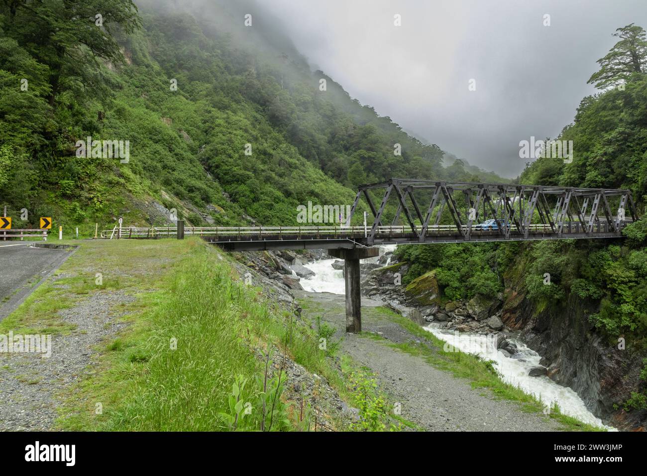 A bridge over the river Haast, near Gates of Haast, on State Highway 6 in the Otago region on the South Island of New Zealand. Stock Photo