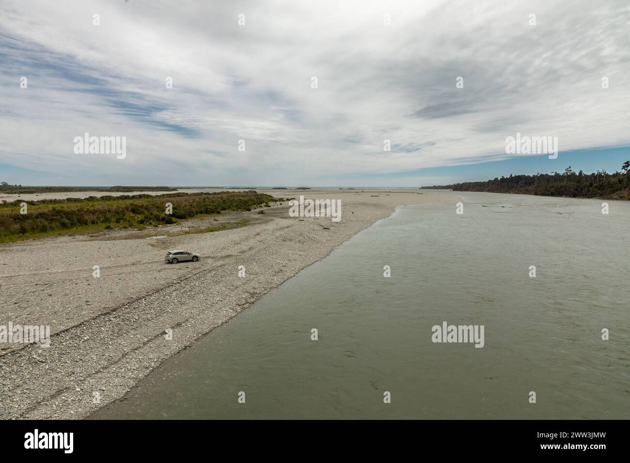 The mouth of the Haast river, with the Tasman Sea in the distance, in the Westland district of the South Island of New Zealand. Stock Photo