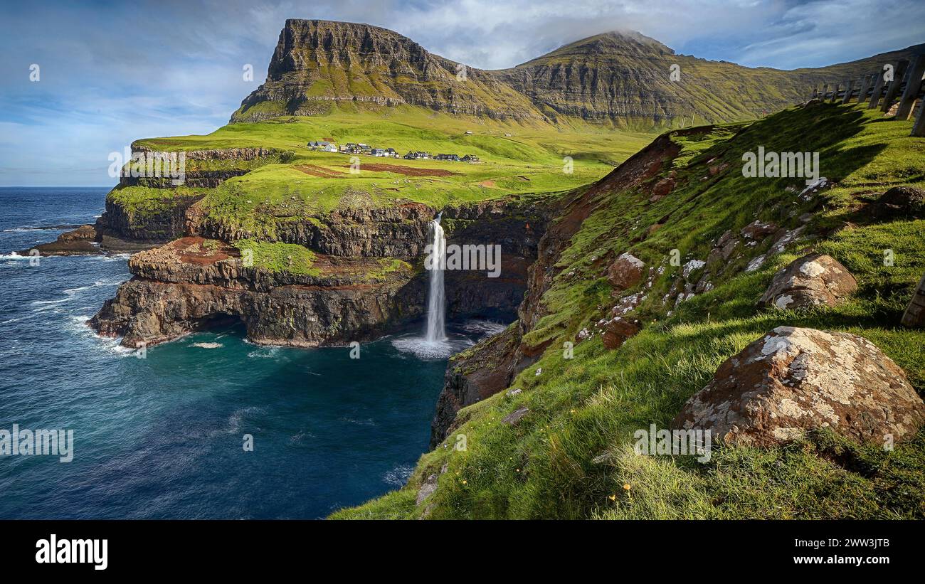Mulafossur, waterfall and village view, Faroe Islands, Faroe Islands, Denmark Stock Photo