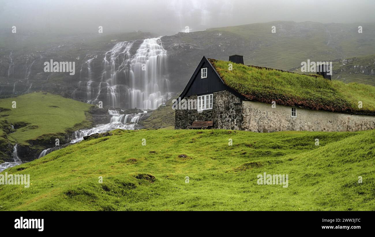 Saksun, waterfall and village view, Faroe Islands, Faroe Islands, Denmark Stock Photo