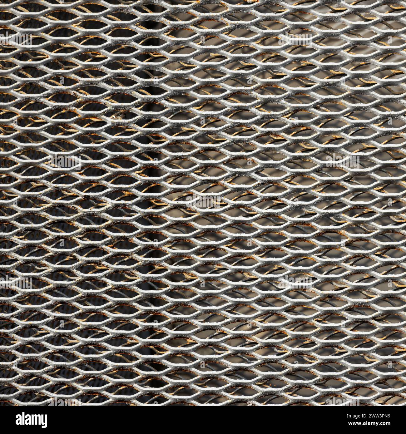 Rusty white metal grille wall, close up square photo texture Stock Photo