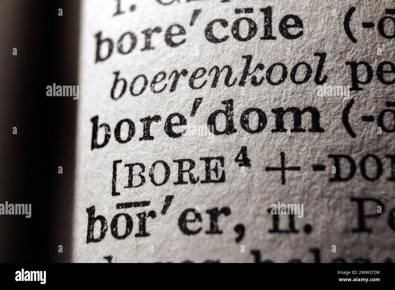 Word boredom on dictionary page, macro close-up Stock Photo