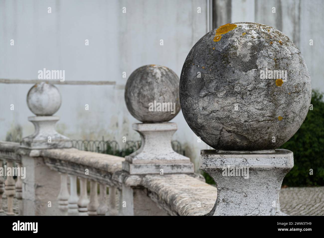 Sphere Through Railing Spheres of granite placed on pillars on balcony railing in public park ...