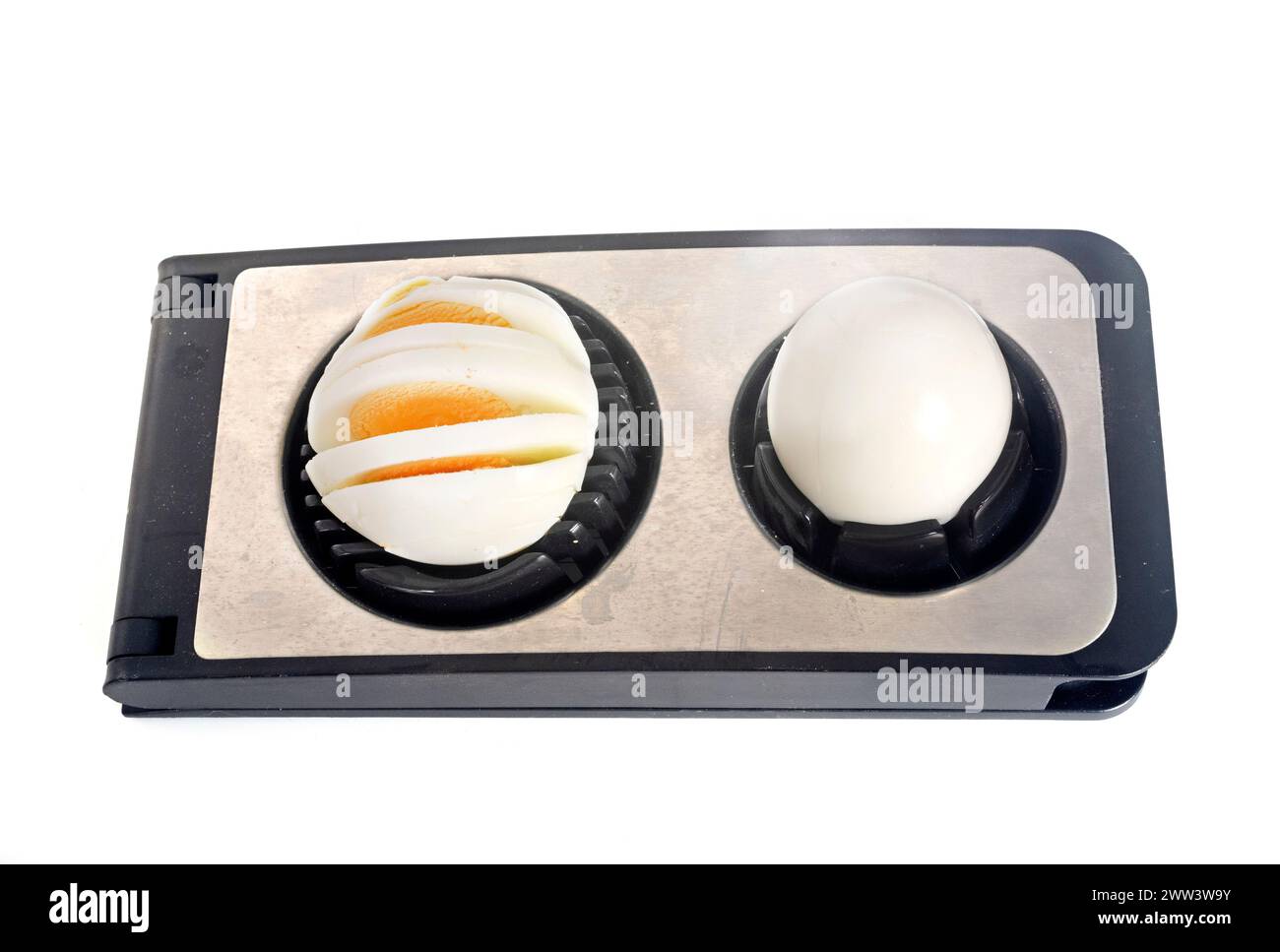 Egg slicer in front of white background Stock Photo