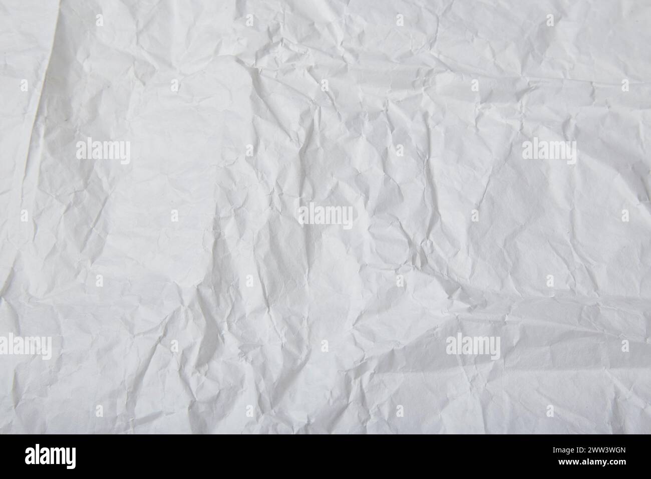 Rustic background of crinkled white paper and copy space. Stock Photo