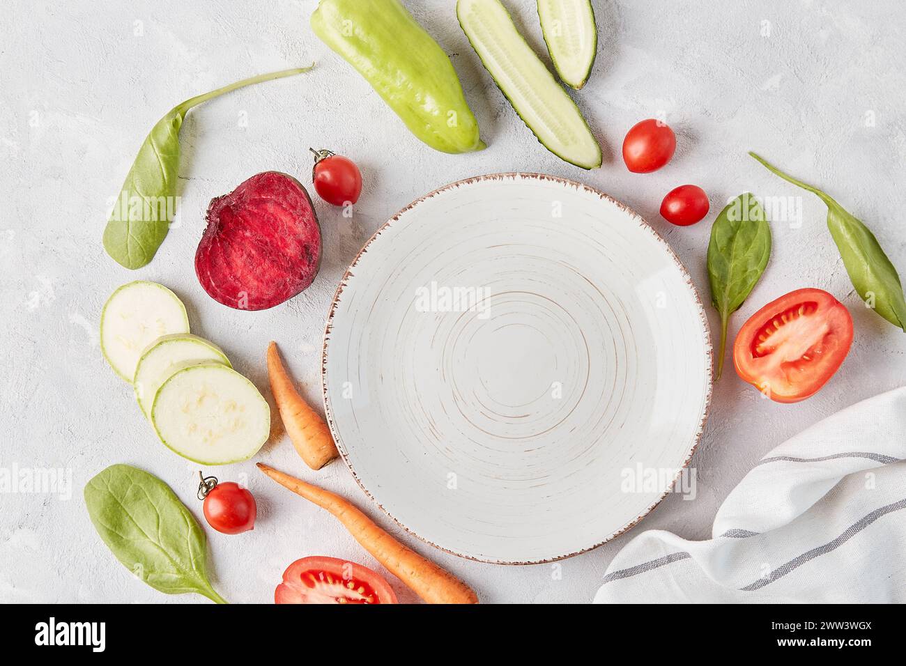 Vegan, organic, healthy food, plant-based diet concept. White plate on the table among vegetables and fruits close up. top view, copy space. Stock Photo