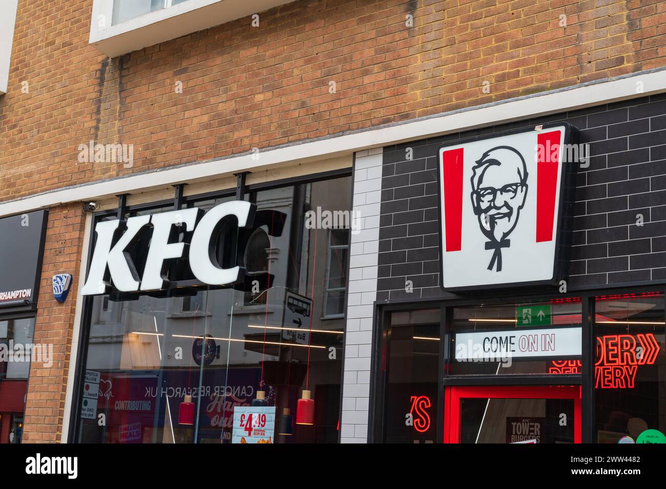 Wolverhampton, UK - March 21 2024: Exterior signage of a UK based KFC restaurant including popular logo Stock Photo