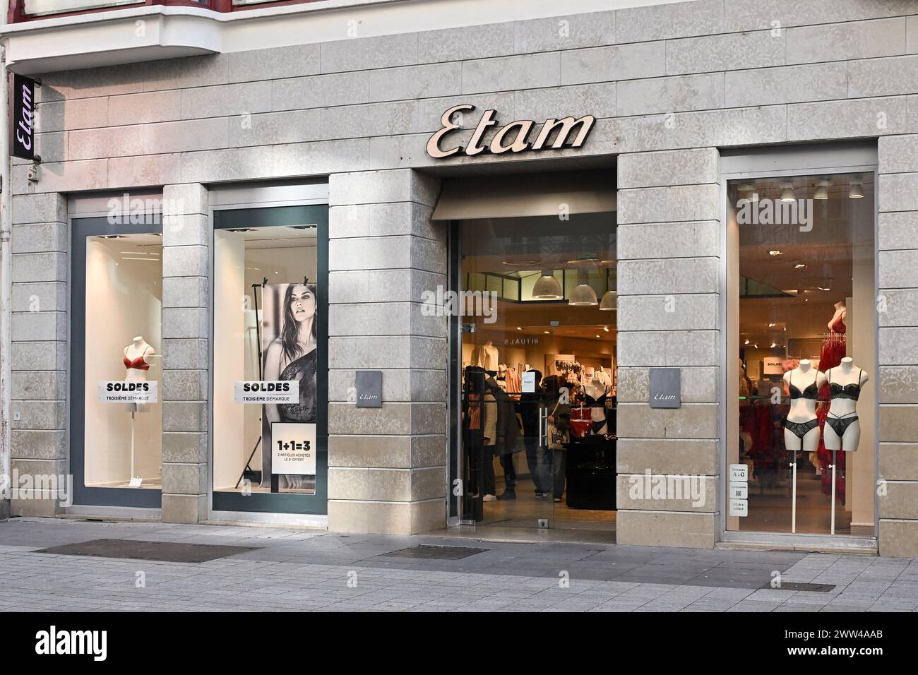 Etam Illustration of commercial signs and shops in Lyon, France on