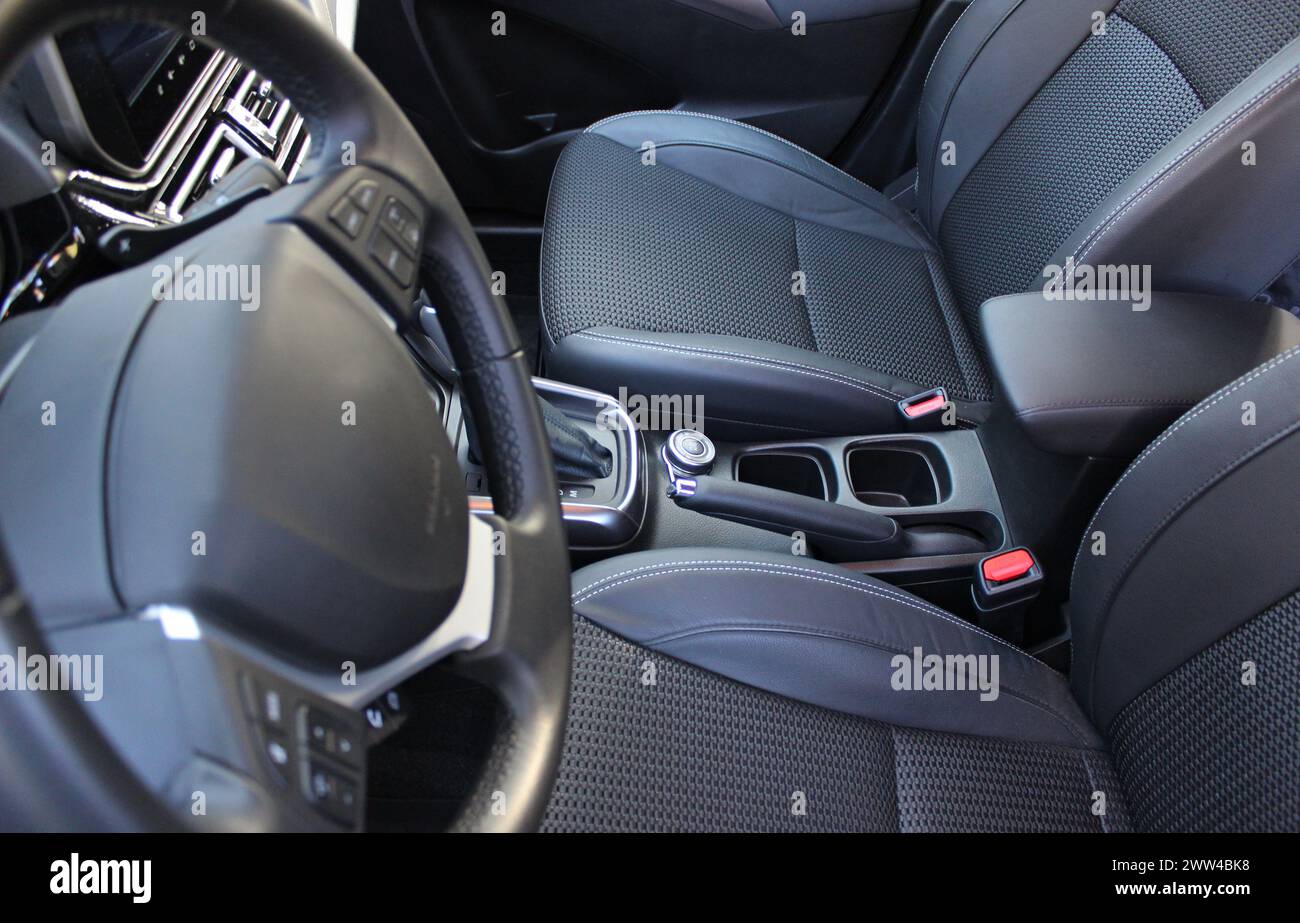 View From Driver Eyes On Steering Wheel And Empty Front Seats Inside A Car Stock Photo