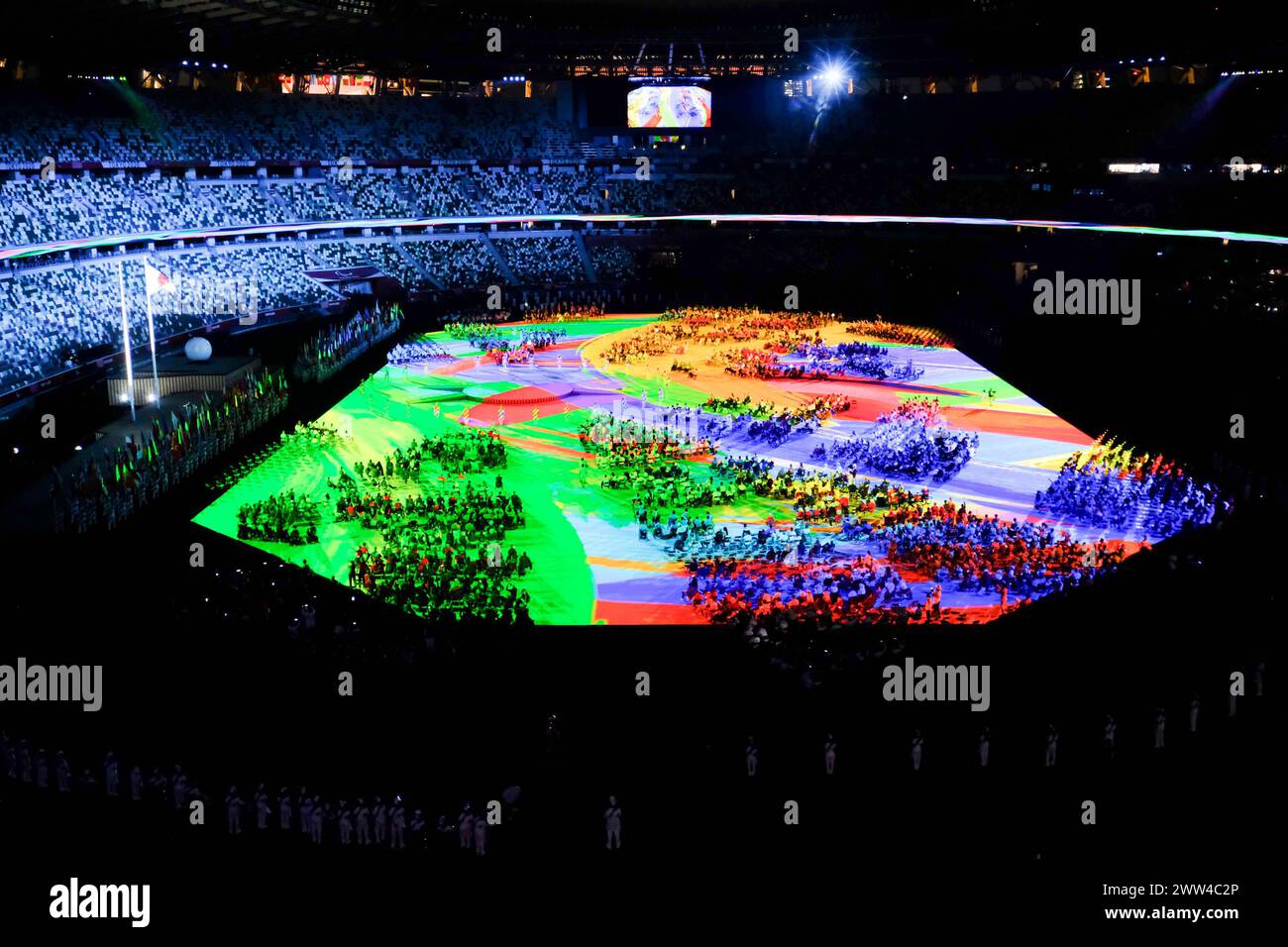 Tokyo, Japan. 21st Mar, 2024. An inspirational opening ceremony at the 'Transformative' Tokyo 2020 Paralympics in Tokyo. Following a year of delay due to the COVID-19 pandemic, the Paralympics officially began at the empty National Stadium in Tokyo. One hundred and sixty-two flags beginning with the Refugee Paralympic Team and concluding with Japan, were represented in the parade of athletes. Credit: SOPA Images Limited/Alamy Live News Stock Photo