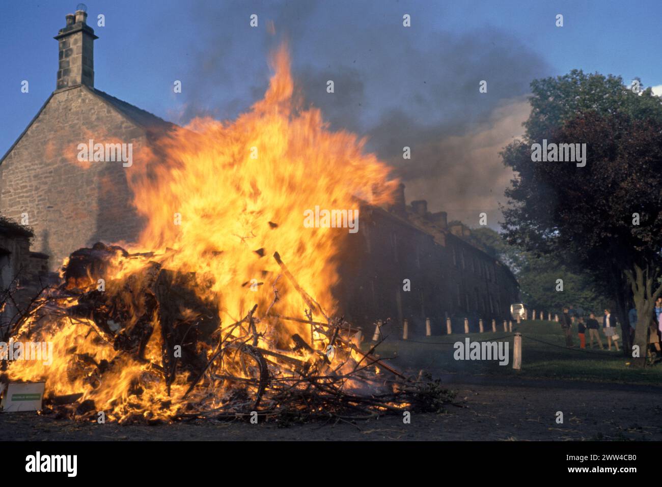 Baal Fire Whalton Northumberland UK. St Johns Eve 23 June annually, outside Beresford Arms in centre of village. 1971 or 1972. The tradition was to take a lighted ember home ensure good luck the following year. 1970s UK HOMER SYKES Stock Photo