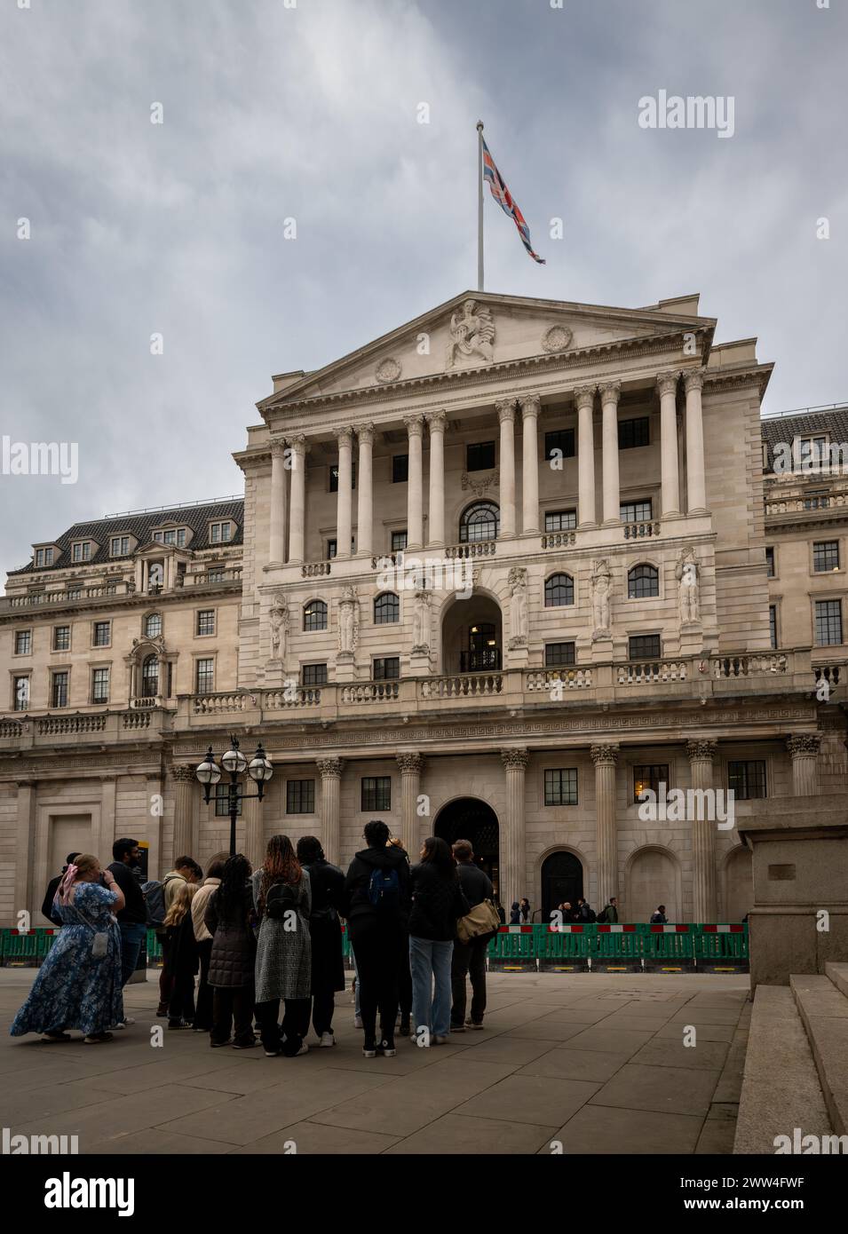 London, UK: The Bank of England on Threadneedle Street in the City of London. Group of people in the foreground. Stock Photo