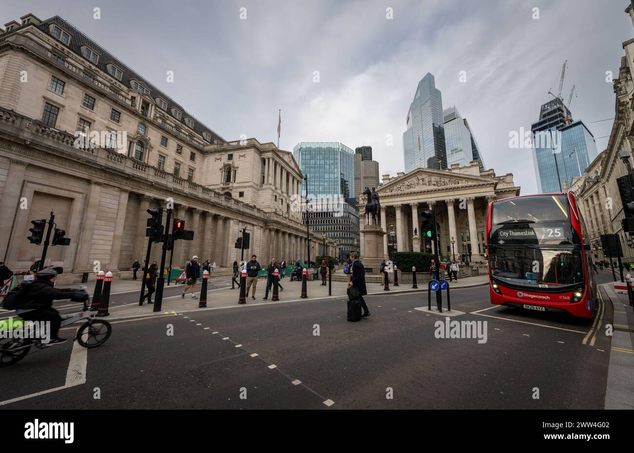 London, UK: Bank Junction in the City of London. Bank of England left, Royal Exchange center and skyscrapers behind. Stock Photo