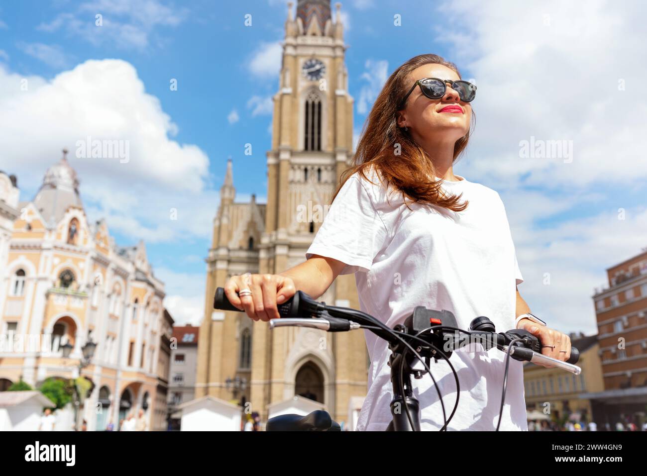 Bike lifestyle in Novi Sad Serbia. Pretty woman stands next to her