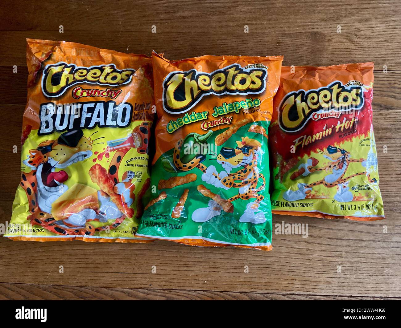 packets of cheetos cheddar jalapeno buffalo and flaming hot cheese flavoured snacks Stock Photo