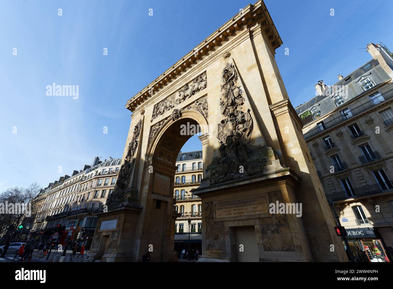 Paris, France -March 16, 2024 : The Porte Saint-Denis is a triumphal ...