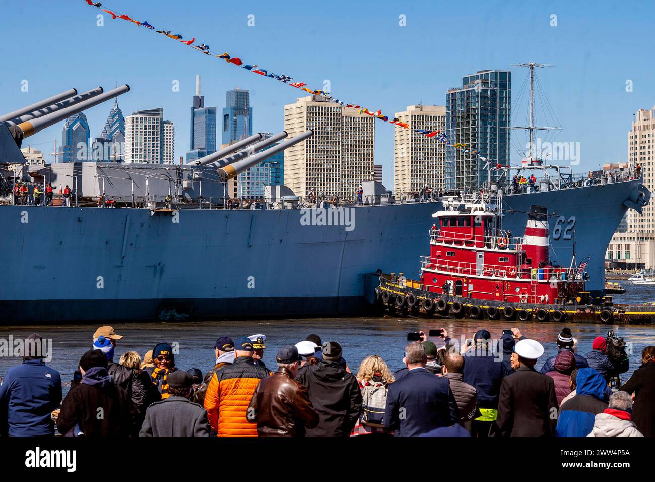 Tugs turn the USS New Jersey around after departing Camden, N.J