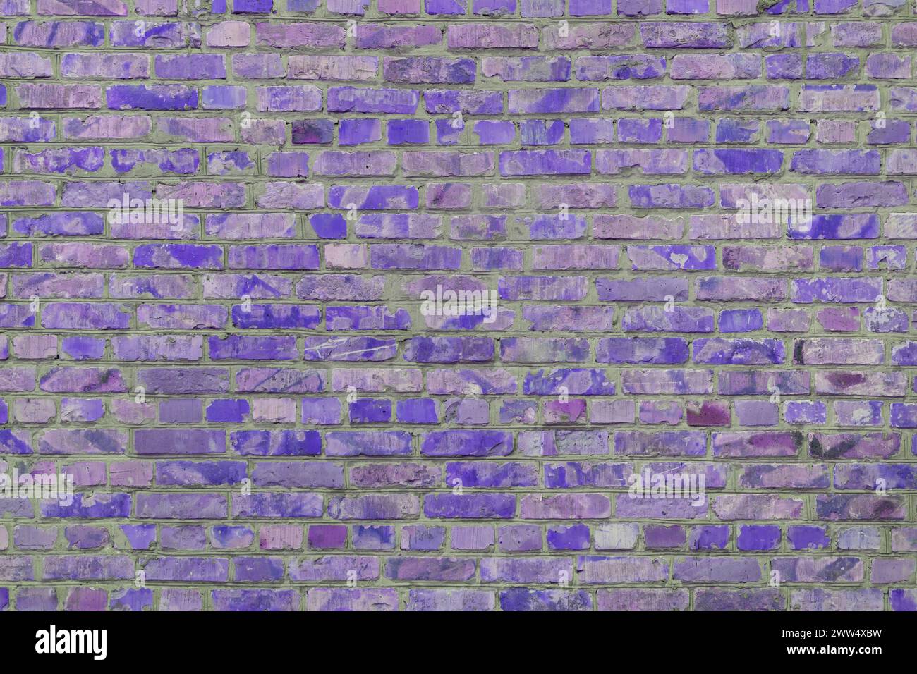 Old purple painted brick wall texture background, architectural element, masonry, brickwork. Backdrop, wallpaper. Stock Photo