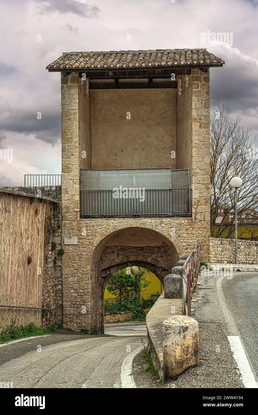 The access gates open along the medieval walls of the city. Porta Leone consists of a tower in which a double arch portal opens. L'Aquila, Italy Stock Photo