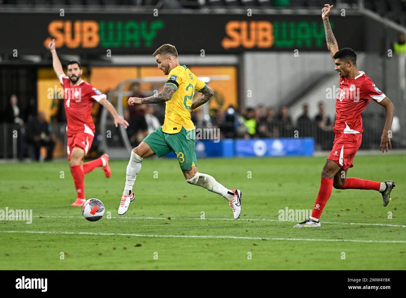 21st March 2024; CommBank Stadium, Sydney, NSW, World Cup Qualifying Football, Australia versus Lebanon; Adam Taggart of Australia attempts to beat the offside trap Stock Photo
