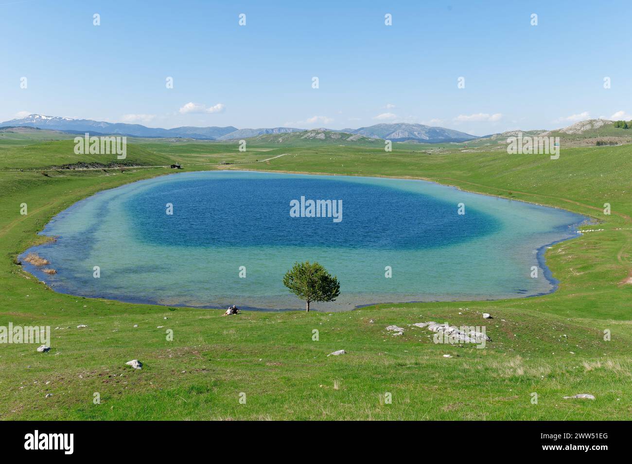Vrazje lake or Devil lake in Durmitor National Park, Montenegro. Beautiful vibrant colors of the blue water and green grass. Stock Photo