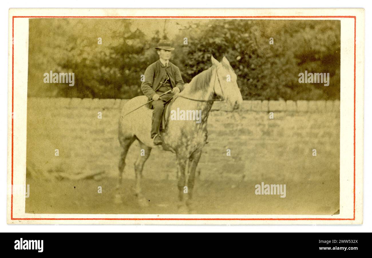 Original Victorian carte de visite (visiting card or CDV) of country image of long ago, a rustic farmer /landowner, Victorian horserider on a beautiful grey mare. Circa 1860's. U.K. Stock Photo