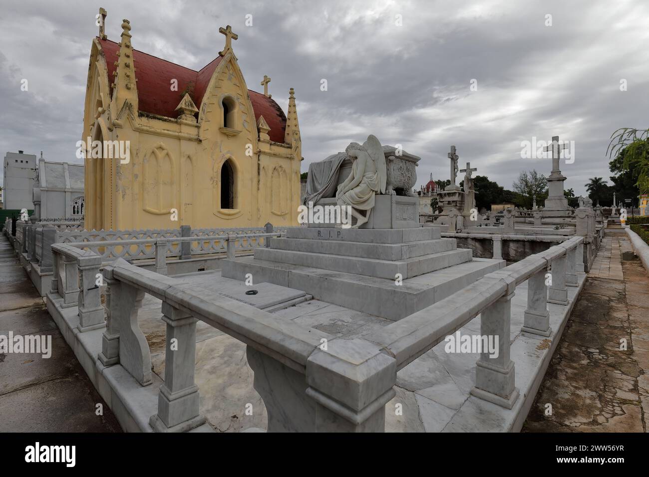 099 Set of statues on pedestals topping graves, yellow Neo-Gothic ...