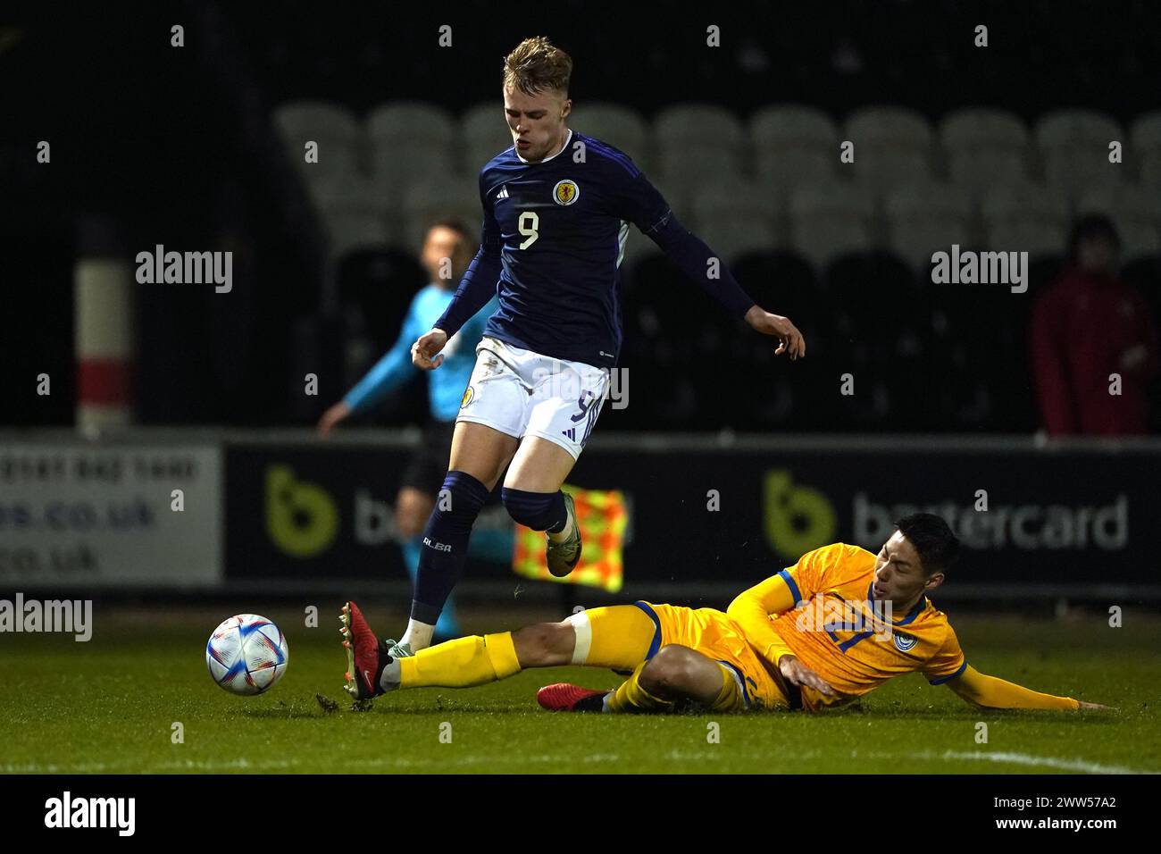 Scotland's Tommy Conway (left) and Kazakhstan's Damir Kassabulat battle for the ball during the UEFA Euro U21 Championship Qualifying Group B match at The SMISA Stadium, Scotland. Picture date: Thursday March 21, 2024. Stock Photo